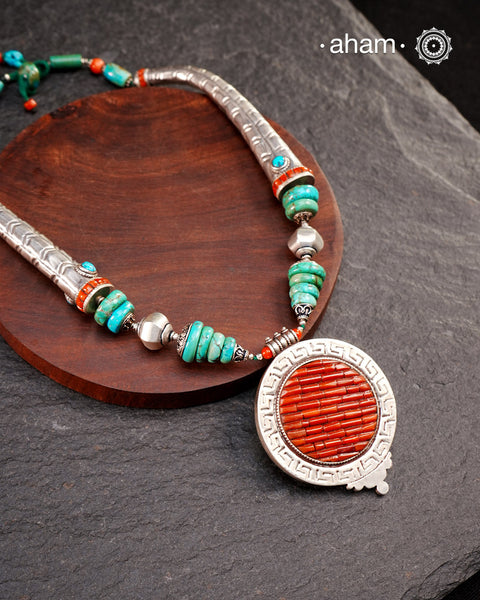 The Tibetan Coral and Turquoise Silver Neckpiece is expertly crafted to reflect the unique design traditions of the Himalayan foothills and Tibetan region. Featuring vibrant coral and turquoise stones set in sterling silver, this piece captures the rich cultural heritage and natural beauty of these high-altitude areas. Its distinctive style offers a timeless elegance, perfect for collectors and connoisseurs who value authentic craftsmanship and region-specific artistry.Region: Tibet/Nepal/HimalayanFootHills