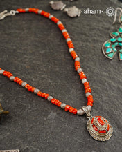 The Himalayan Coral Silver Neckpiece is expertly crafted to reflect the unique design traditions of the Himalayan foothills and Tibetan region. Featuring the pendant with vibrant coral and stones set in sterling silver and strung with raw coral beads interspersed with intricately detailed silver beads, this piece captures the rich cultural heritage and natural beauty of these high-altitude areas. Its distinctive style offers a timeless elegance.
