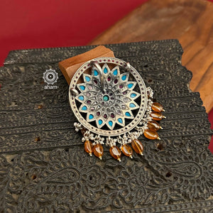 Beautiful Nrityam Pendant crafted in silver with turquoise and kemp highlights, laced with beautiful brown stones and pearls. Wear it with a silver chain, a halsi or with beads of your choice.