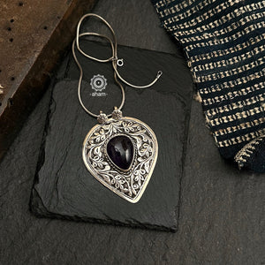 Mewad pendant with intricate floral Chitai work and a beautiful black stone in the center. Handcrafted in 92.5 sterling silver. Wear it with a long chain on your formal Indian wear to complete your work look.  (Does not include chain)