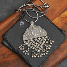 Mewad pendant with intricate floral work. Crafted in 92.5 sterling silver.(Does not include chain). Wear it with a long chain on your Indian wear to complete your work look. 