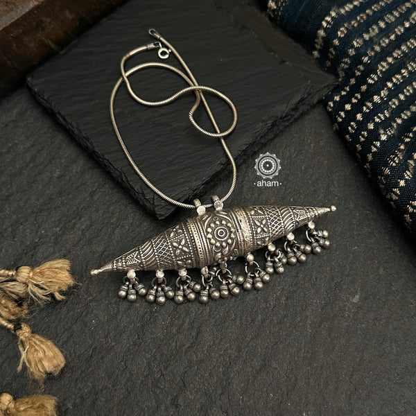 Mewad amulet pendant with intricate floral work. Crafted in 92.5 sterling silver. Wear it with a long chain on your formal Indian wear to complete your work look. (Does not include chain).