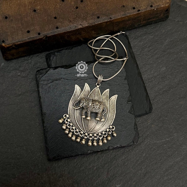 Mewad Lotus pendant with beautiful elephant motif. Crafted in 92.5 sterling silver. Wear it with a long chain on your Indian wear to complete your work look. (Does not include chain).