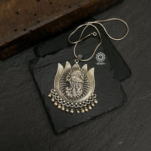 Mewad Lotus pendant with beautiful peacock motif. Crafted in 92.5 sterling silver. Wear it with a long chain on your Indian wear to complete your work look. (Does not include chain).