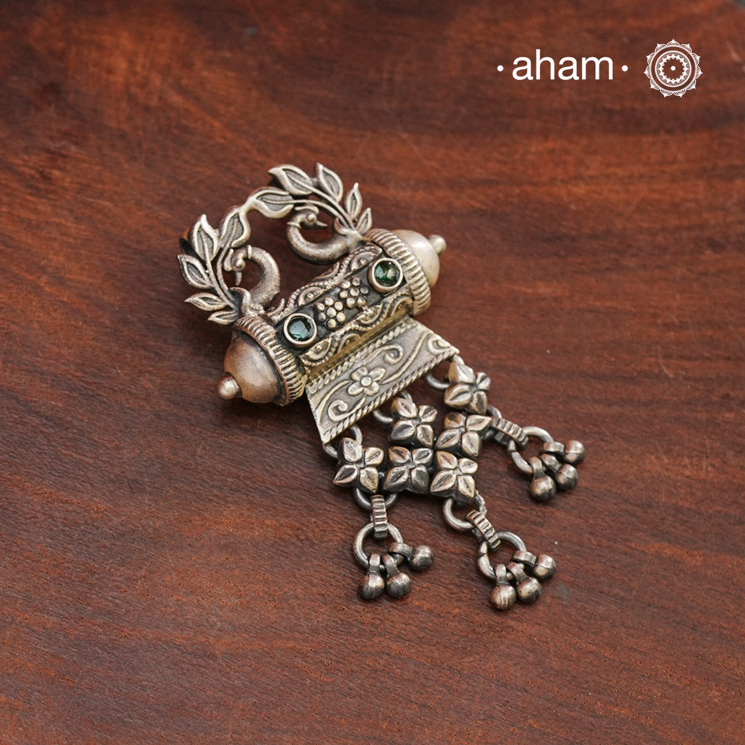 This classic silver pendant features beautifully detailed peacocks and is handcrafted in 92.5 silver by skilled artisans from Rajasthan. Enhance your professional look with this exquisite piece.
(Does not include chain)