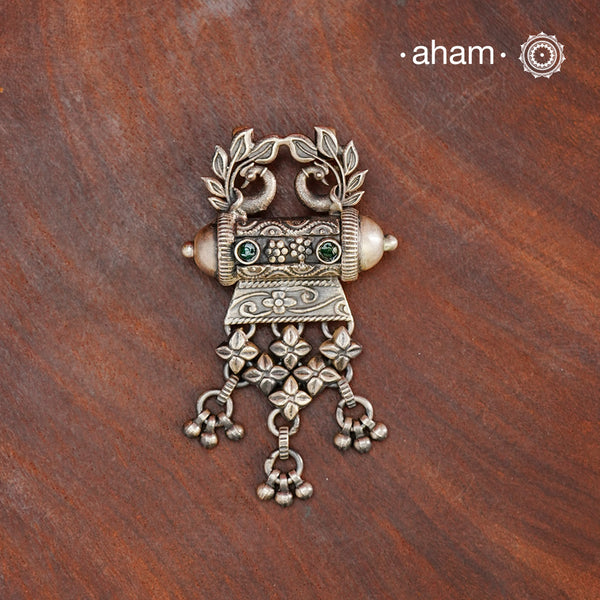 This classic silver pendant features beautifully detailed peacocks and is handcrafted in 92.5 silver by skilled artisans from Rajasthan. Enhance your professional look with this exquisite piece.
(Does not include chain)