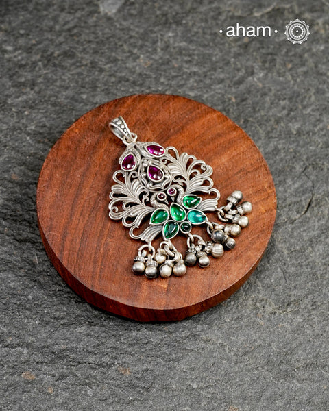 Mewad pendant with peacock and floral work, crafted in 92.5 sterling silver. Wear it with a long chain on your Indian wear to complete your work look.
(Does not include chain)