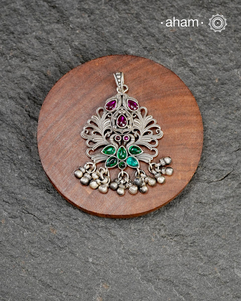 Mewad pendant with peacock and floral work, crafted in 92.5 sterling silver. Wear it with a long chain on your Indian wear to complete your work look.
(Does not include chain)