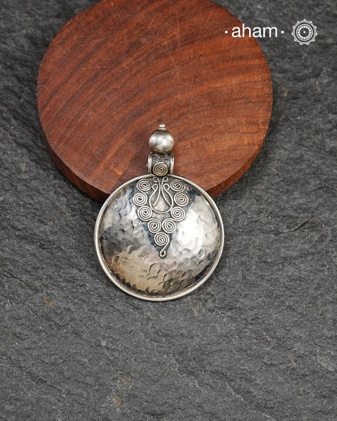 Mewad silver pendant crafted in 92.5 silver with beaten texture. Wear it with a wire hasli, or a black thread. Perfect to wear to work or a casual evening out.