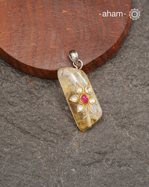 Citrine stone with inlay work silver pendant.
Works great with work wear or even your evening dress.