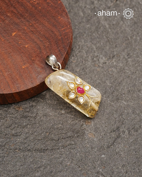 Citrine stone with inlay work silver pendant.
Works great with work wear or even your evening dress.