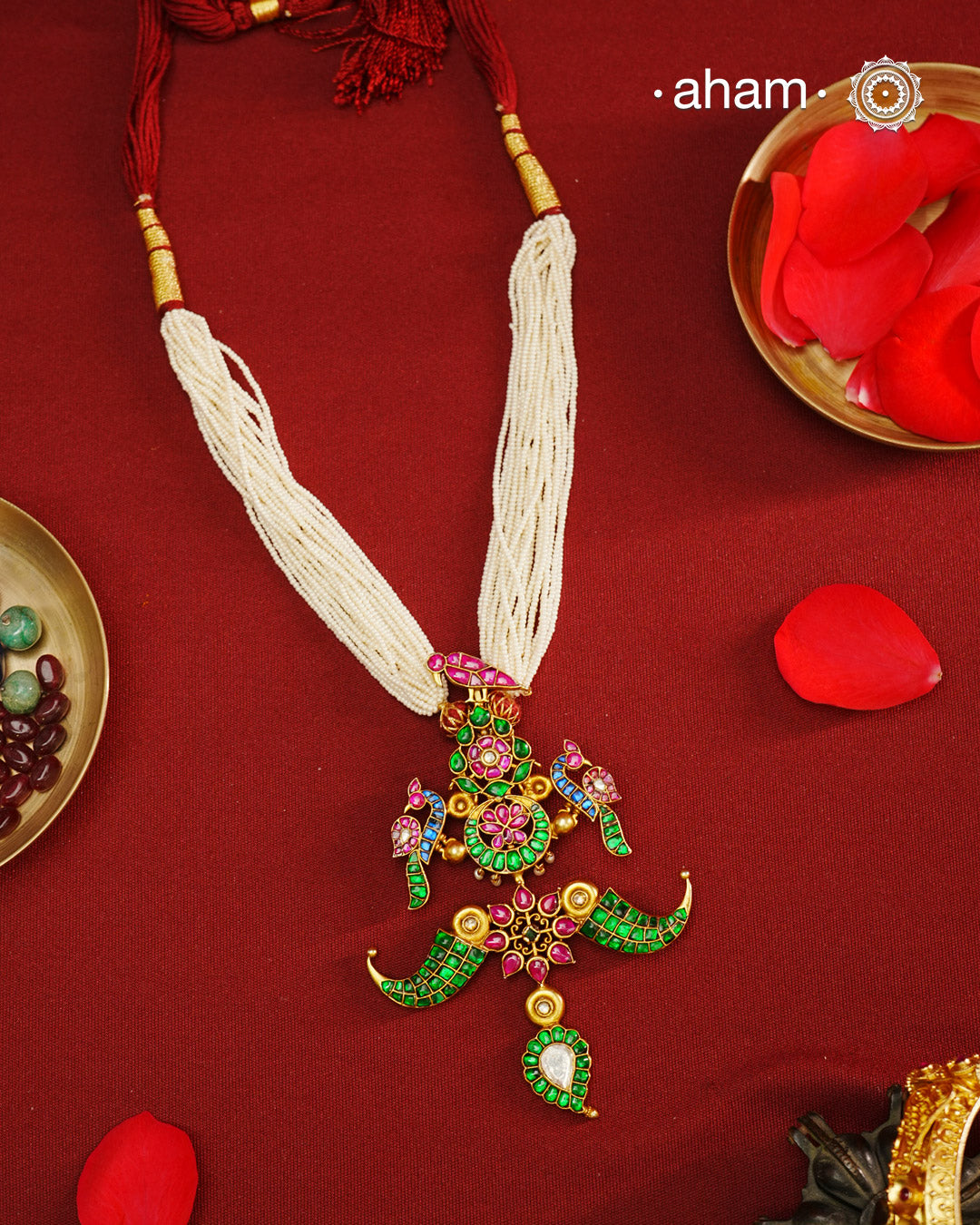 Make a style statement with this gold polish festive neckpiece. Crafted using traditional techniques in silver with kundan floral, peacock and tiger tooth motifs. Perfect for intimate weddings and upcoming festive celebrations.