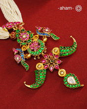 Make a style statement with this gold polish festive neckpiece. Crafted using traditional techniques in silver with kundan floral, peacock and tiger tooth motifs. Perfect for intimate weddings and upcoming festive celebrations.