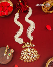 A large statement mother of pearl pendant crafted in 92.5 silver with gold polish.
Comes with strands of Faux pearls.
