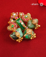 One of a kind 92.5 sterling silver gold polish pendant with beautiful nature inspired motifs, traditional craftsmanship and interesting use of tumbled emeralds. Handcrafted by skilful artisans.