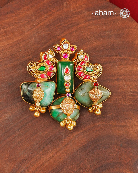 One of a kind 92.5 sterling silver gold polish pendant with beautiful nature inspired motifs, traditional craftsmanship and interesting use of tumbled emeralds. Handcrafted by skilful artisans.