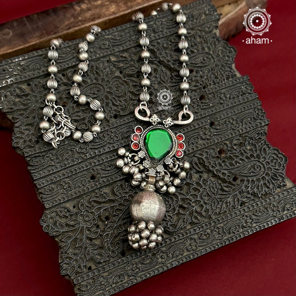 Long silver neckpiece made by putting together unique vintage tribal silver borla with a vintage glass piece. Looks great when paired with workwear kurtas, saris or even a shirt. 