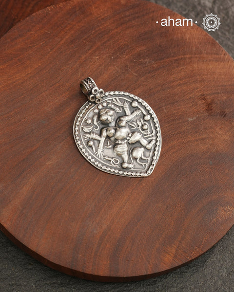 Discover the charm of traditional craftsmanship with our Handmade 92.5 Sterling Silver Kal Bhairav Amulet Pendant. Expertly crafted using the thapi (stamp die) technique, this pendant reflects the age-old artistry of India’s tribal communities. Known by various names like Kavach, Mandaliya, Patri, and Kathla, amulet pendants have long been cherished as symbols of passive worship—a way to keep your deity, Kuldevta, or Kuldevi close to your heart. Traditionally worn on a cord or silver chain.