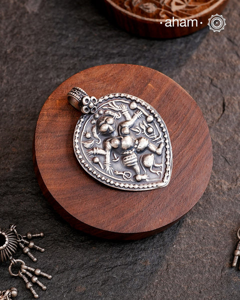 Discover the charm of traditional craftsmanship with our Handmade 92.5 Sterling Silver Kal Bhairav Amulet Pendant. Expertly crafted using the thapi (stamp die) technique, this pendant reflects the age-old artistry of India’s tribal communities. Known by various names like Kavach, Mandaliya, Patri, and Kathla, amulet pendants have long been cherished as symbols of passive worship—a way to keep your deity, Kuldevta, or Kuldevi close to your heart. Traditionally worn on a cord or silver chain.