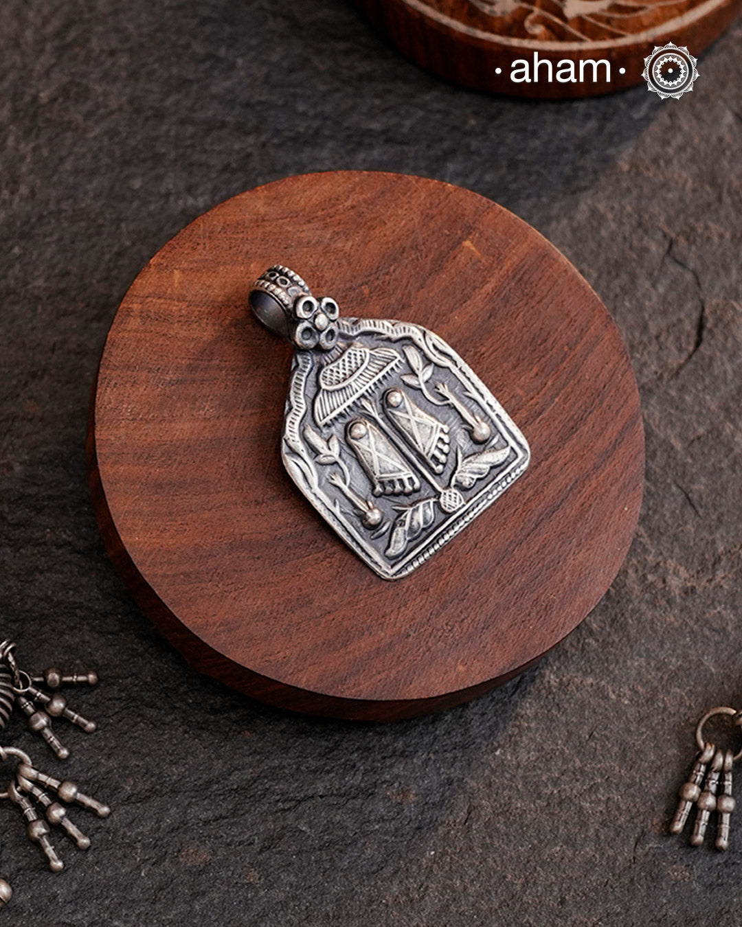 Discover the charm of traditional craftsmanship with our Handmade 92.5 Sterling Silver Laxmi Feet Pendant.Expertly crafted using the thapi (stamp die) technique, this pendant reflects the age-old artistry of India’s tribal communities. Known by various names like Kavach, Mandaliya, Patri, and Kathla, amulet pendants have long been cherished as symbols of passive worship—a way to keep your deity, Kuldevta, or Kuldevi close to your heart.