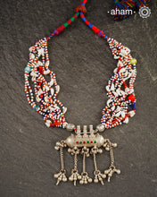 Beautiful handcrafted tribal silver amulet pendant with hanging Ghunroos. Comes with stunning kutchi vintage beadwork that has been restored.