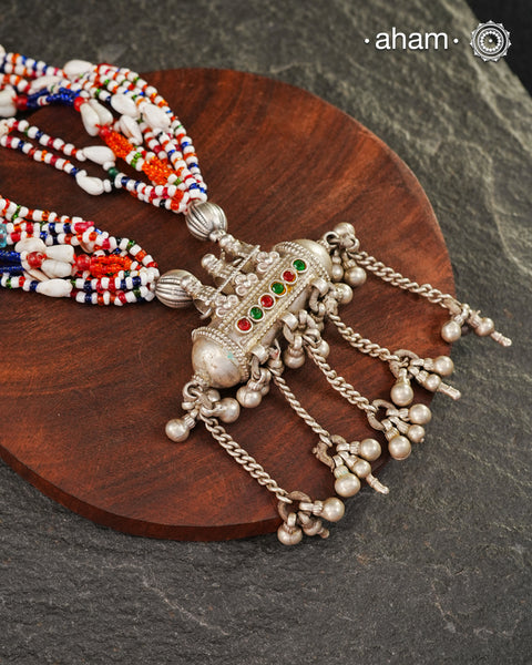 Beautiful handcrafted tribal silver amulet pendant with hanging Ghunroos. Comes with stunning kutchi vintage beadwork that has been restored.