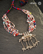 Beautiful handcrafted tribal silver amulet pendant with hanging Ghunroos. Comes with stunning kutchi vintage beadwork that has been restored.