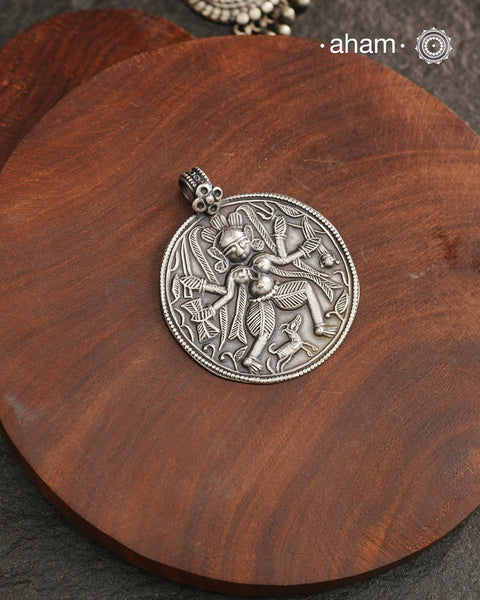 Discover the charm of traditional craftsmanship with our Silver Lord Bhairav Pendant.Expertly crafted using the thapi (stamp die) technique, this pendant reflects the age-old artistry of India’s tribal communities. Known by various names like Kavach, Mandaliya, Patri, and Kathla, amulet pendants have long been cherished as symbols of passive worship—a way to keep your deity, Kuldevta, or Kuldevi close to your heart. 