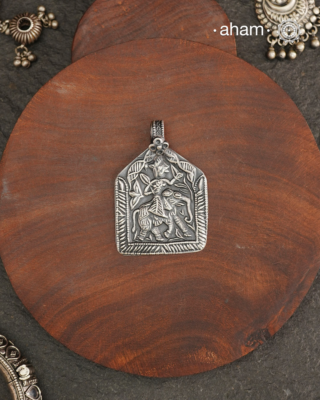 Discover the charm of traditional craftsmanship with our Handmade Lord Indra 92.5 Sterling Silver Pendant.

Expertly crafted using the thapi (stamp die) technique, this pendant reflects the age-old artistry of India’s tribal communities. Known by various names like Kavach, Mandaliya, Patri, and Kathla, amulet pendants have long been cherished as symbols of passive worship—a way to keep your deity, Kuldevta, or Kuldevi close to your heart.