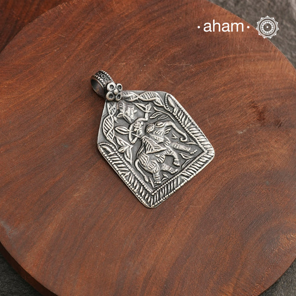 Discover the charm of traditional craftsmanship with our Handmade Lord Indra 92.5 Sterling Silver Pendant.

Expertly crafted using the thapi (stamp die) technique, this pendant reflects the age-old artistry of India’s tribal communities. Known by various names like Kavach, Mandaliya, Patri, and Kathla, amulet pendants have long been cherished as symbols of passive worship—a way to keep your deity, Kuldevta, or Kuldevi close to your heart.