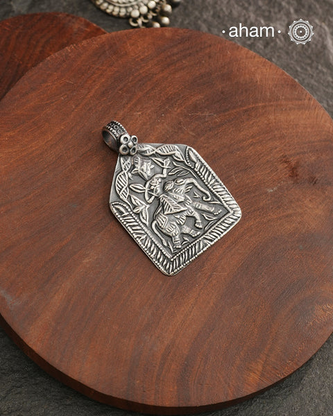 Discover the charm of traditional craftsmanship with our Handmade Lord Indra 92.5 Sterling Silver Pendant.

Expertly crafted using the thapi (stamp die) technique, this pendant reflects the age-old artistry of India’s tribal communities. Known by various names like Kavach, Mandaliya, Patri, and Kathla, amulet pendants have long been cherished as symbols of passive worship—a way to keep your deity, Kuldevta, or Kuldevi close to your heart.