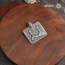 Discover the charm of traditional craftsmanship with our Handmade Ganesh Lakshmi 92.5 Sterling Silver Pendant.Expertly crafted using the thapi (stamp die) technique, this pendant reflects the age-old artistry of India’s tribal communities. Known by various names like Kavach, Mandaliya, Patri, and Kathla, amulet pendants have long been cherished as symbols of passive worship—a way to keep your deity, Kuldevta, or Kuldevi close to your heart. Traditionally worn on a cord or silver chain, this striking amulet 