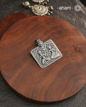 Discover the charm of traditional craftsmanship with our Handmade Ganesh Lakshmi 92.5 Sterling Silver Pendant.Expertly crafted using the thapi (stamp die) technique, this pendant reflects the age-old artistry of India’s tribal communities. Known by various names like Kavach, Mandaliya, Patri, and Kathla, amulet pendants have long been cherished as symbols of passive worship—a way to keep your deity, Kuldevta, or Kuldevi close to your heart. Traditionally worn on a cord or silver chain, this striking amulet 