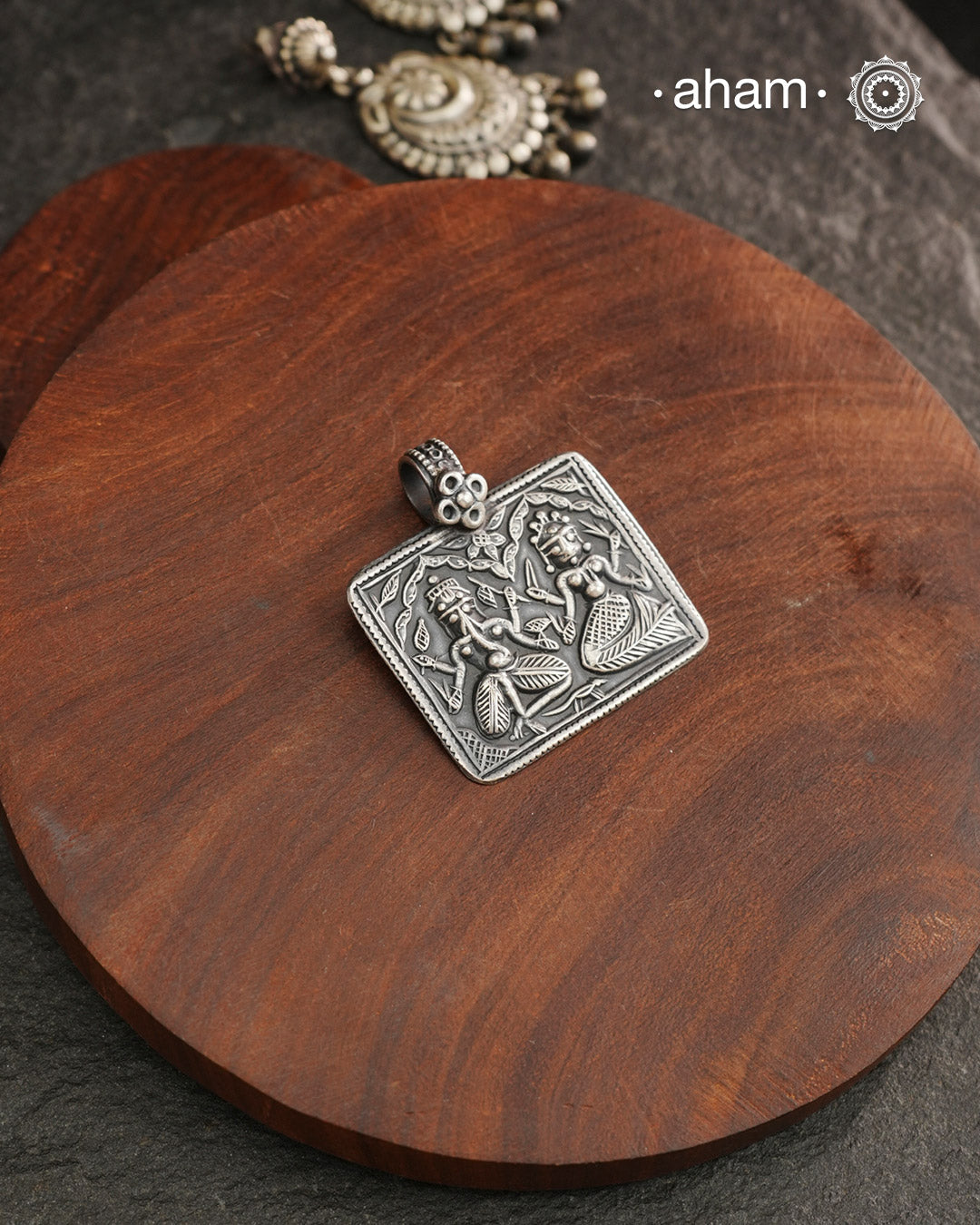 Discover the charm of traditional craftsmanship with our Handmade Ganesh Lakshmi 92.5 Sterling Silver Pendant.Expertly crafted using the thapi (stamp die) technique, this pendant reflects the age-old artistry of India’s tribal communities. Known by various names like Kavach, Mandaliya, Patri, and Kathla, amulet pendants have long been cherished as symbols of passive worship—a way to keep your deity, Kuldevta, or Kuldevi close to your heart. Traditionally worn on a cord or silver chain, this striking amulet 