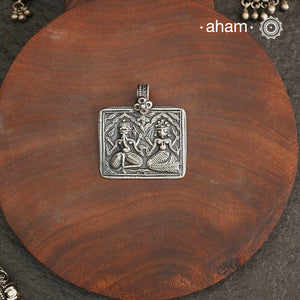 Discover the charm of traditional craftsmanship with our Handmade Ganesh Lakshmi 92.5 Sterling Silver Pendant.Expertly crafted using the thapi (stamp die) technique, this pendant reflects the age-old artistry of India’s tribal communities. Known by various names like Kavach, Mandaliya, Patri, and Kathla, amulet pendants have long been cherished as symbols of passive worship—a way to keep your deity, Kuldevta, or Kuldevi close to your heart. Traditionally worn on a cord or silver chain, this striking amulet 