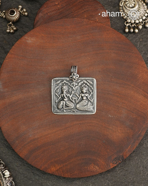 Discover the charm of traditional craftsmanship with our Handmade Ganesh Lakshmi 92.5 Sterling Silver Pendant.Expertly crafted using the thapi (stamp die) technique, this pendant reflects the age-old artistry of India’s tribal communities. Known by various names like Kavach, Mandaliya, Patri, and Kathla, amulet pendants have long been cherished as symbols of passive worship—a way to keep your deity, Kuldevta, or Kuldevi close to your heart. Traditionally worn on a cord or silver chain, this striking amulet 