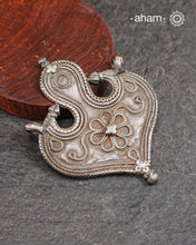 Vintage Tribal Silver Pendant, a Beautifully handcrafted tribal silver amulet pendant from a bygone area, that bring back memories and stories of that time.&nbsp;Wear it with a long chain or with a black thread, or layer them to create a distinct look. This Amulet reflects a beautiful blend of faith and craftsmanship — a perfect representation of heritage jewellery.