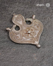 Vintage Tribal Silver Pendant, a Beautifully handcrafted tribal silver amulet pendant from a bygone area, that bring back memories and stories of that time.&nbsp;Wear it with a long chain or with a black thread, or layer them to create a distinct look. This Amulet reflects a beautiful blend of faith and craftsmanship — a perfect representation of heritage jewellery.