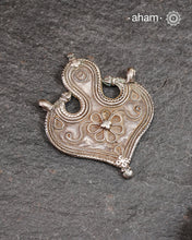 Vintage Tribal Silver Pendant, a Beautifully handcrafted tribal silver amulet pendant from a bygone area, that bring back memories and stories of that time.&nbsp;Wear it with a long chain or with a black thread, or layer them to create a distinct look. This Amulet reflects a beautiful blend of faith and craftsmanship — a perfect representation of heritage jewellery.