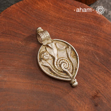 Tribal Silver Snake Pendant, a beautifully handcrafted tribal silver pendant from a bygone area, that bring back memories and stories of that time. Wear it with a long chain or with a black thread, or layer them to create a distinct look. This Amulet reflects a beautiful blend of faith and craftsmanship — a perfect representation of heritage jewellery.