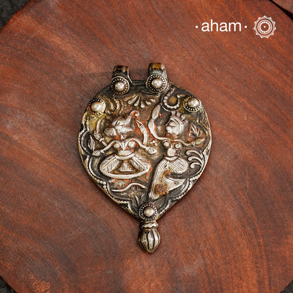 Tribal Silver Ganesh Lakshmi Pendant, a Beautifully handcrafted tribal silver amulet pendant from a bygone area, that bring back memories and stories of that time. Wear it with a long chain or with a black thread, or layer them to create a distinct look. This Amulet reflects a beautiful blend of faith and craftsmanship — a perfect representation of heritage jewellery.