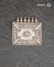 A rectangle shaped amulet representative of a home, four walls with a center courtyard. The pendant that represents shelter, stability, and divine presence within the home.&nbsp; It is a powerful symbol of family unity and protection. This pendant is hand crafted in silver.
Beautiful handcrafted tribal silver amulet pendant from a bygone area, that bring back memories and stories of that time. Wear it with a long chain or with a black thread, or layer them to create a distinct look.