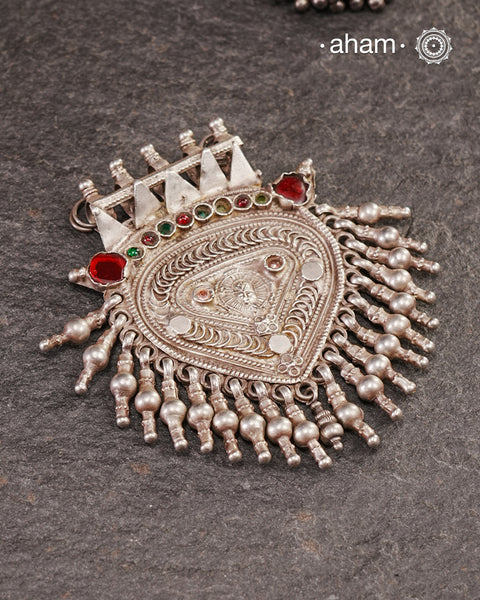 Beautiful handcrafted Arrowhead tribal silver pendant with Sun God- Surya stamped in the center, A piece from a bygone area, that bring back memories and stories of that time. The pendant has some beautiful stone highlights that bring out the beauty of the piece even more. Wear it with a long chain or with a black thread, or layer them to create a distinct look.