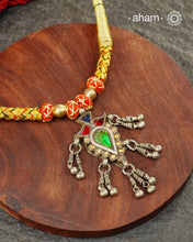 Discover this distinctive Tribal Silver Neckpiece, a handcrafted statement piece made with 80% silver. Its unique tribal-inspired design and substantial pendant bring the character of traditional Indian adornment to contemporary festive dressing. The neckpiece sits below the neck and features an adjustable cotton-thread fastening, making it a striking choice for Navratri, Garba nights and festive occasions. Style it with a chaniya choli, Bandhani, mirror-work outfit, saree or contemporary Indian wear.