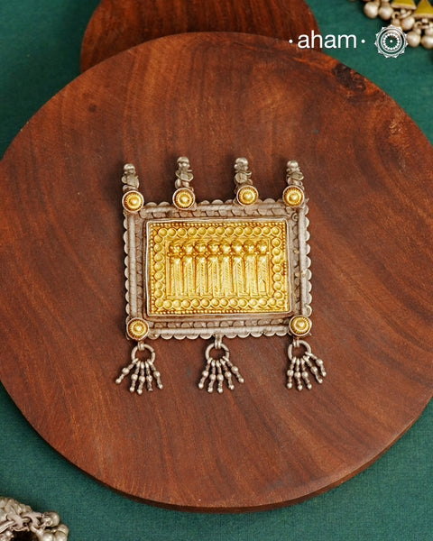 Enhance your style with the timeless elegance of the Dual Tone Silver Pendant. Handcrafted by skilled karigars in Barmer, Rajasthan, this neckpiece features traditional Bandhel work, where a thin sheet of hand beaten&nbsp;22 carat gold is set on 92.5 silver using a unique wax setting technique. A classic representation of fine Indian traditional craftsmanship.