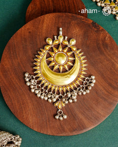 Enhance your style with the timeless elegance of the Dual Tone Silver Pendant. Handcrafted by skilled karigars in Barmer, Rajasthan, this neckpiece features traditional Bandhel work, where a thin sheet of hand beaten&nbsp;22 carat gold is set on 92.5 silver using a unique wax setting technique. A classic representation of fine Indian traditional craftsmanship.&nbsp;

Chain not included