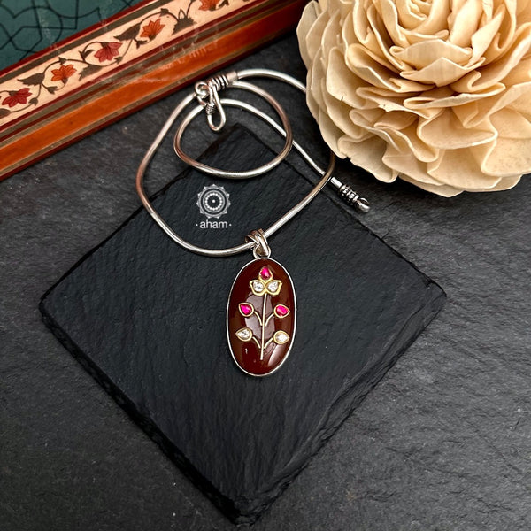 Handmade stone pendant with Mughal Inspired intricate floral inlay work in semi precious stone setting, encased in silver. Wear it long or short with a chain of your choice, or a smart silver Hasli. A piece so timeless that it can we worn across generations. (Does not include chain)