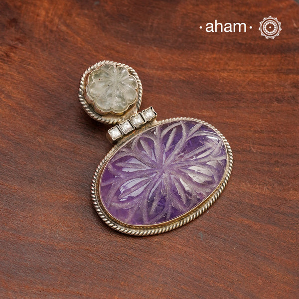 Handmade ira stone pendant with Mughal Inspired intricate floral work in semi precious stone setting, encased in silver. Wear it long or short with a chain of your choice, or a smart silver Hasli. A piece so timeless that it can we worn across generations. Please note, each piece created in this series is unique and one of a kind.
(Does not include chain)