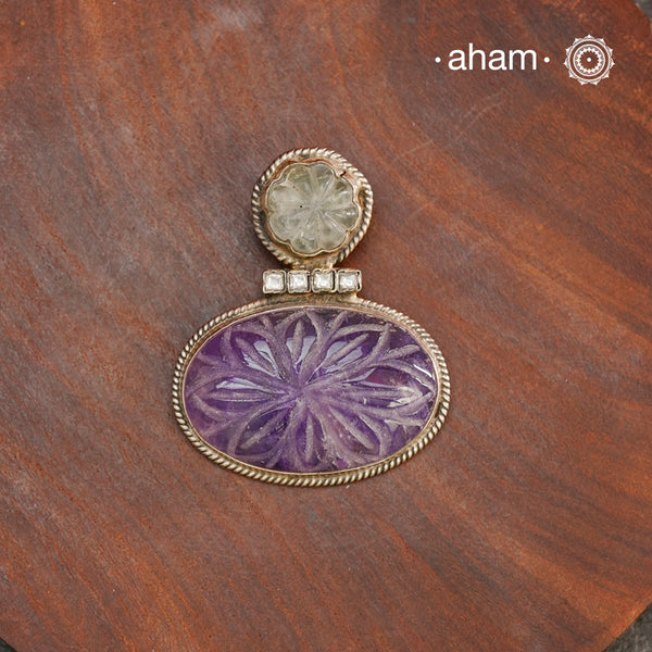Handmade ira stone pendant with Mughal Inspired intricate floral work in semi precious stone setting, encased in silver. Wear it long or short with a chain of your choice, or a smart silver Hasli. A piece so timeless that it can we worn across generations.&nbsp;Please note, each piece created in this series is unique and one of a kind.
(Does not include chain)