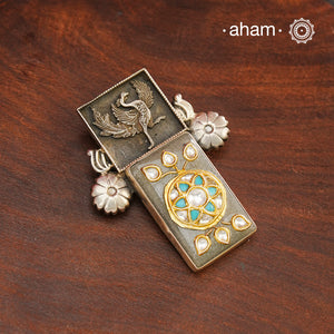 Handmade ira stone pendant with intricate floral inlay work in semi precious stone setting, encased in silver. Wear it long or short with a chain of your choice, or a smart silver Hasli. A piece so timeless that it can we worn across generations. Please note, each piece created in this series is unique and one of a kind.
(Does not include chain)
